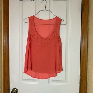Peach tank top with peach rhinestones on the front, size M
